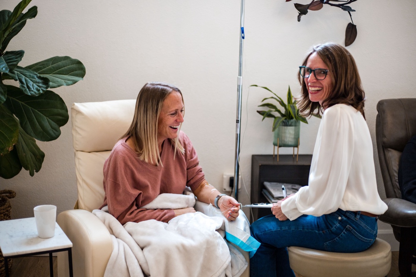 Dr. Franks laughing with a patient during an IV