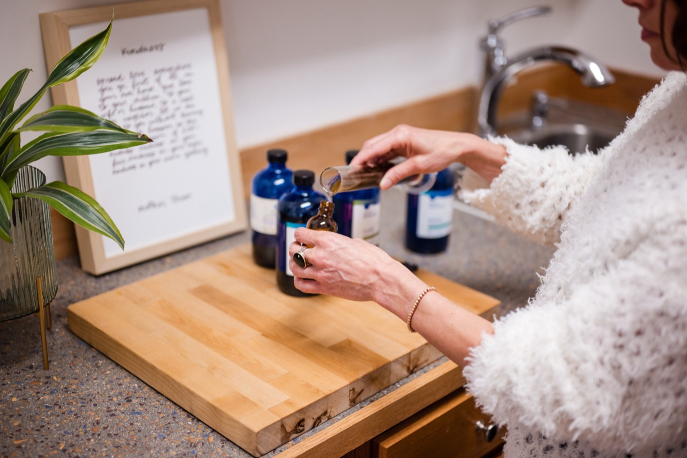 Dr. Franks preparing an herbal tincture from Heron Botanicals bottles