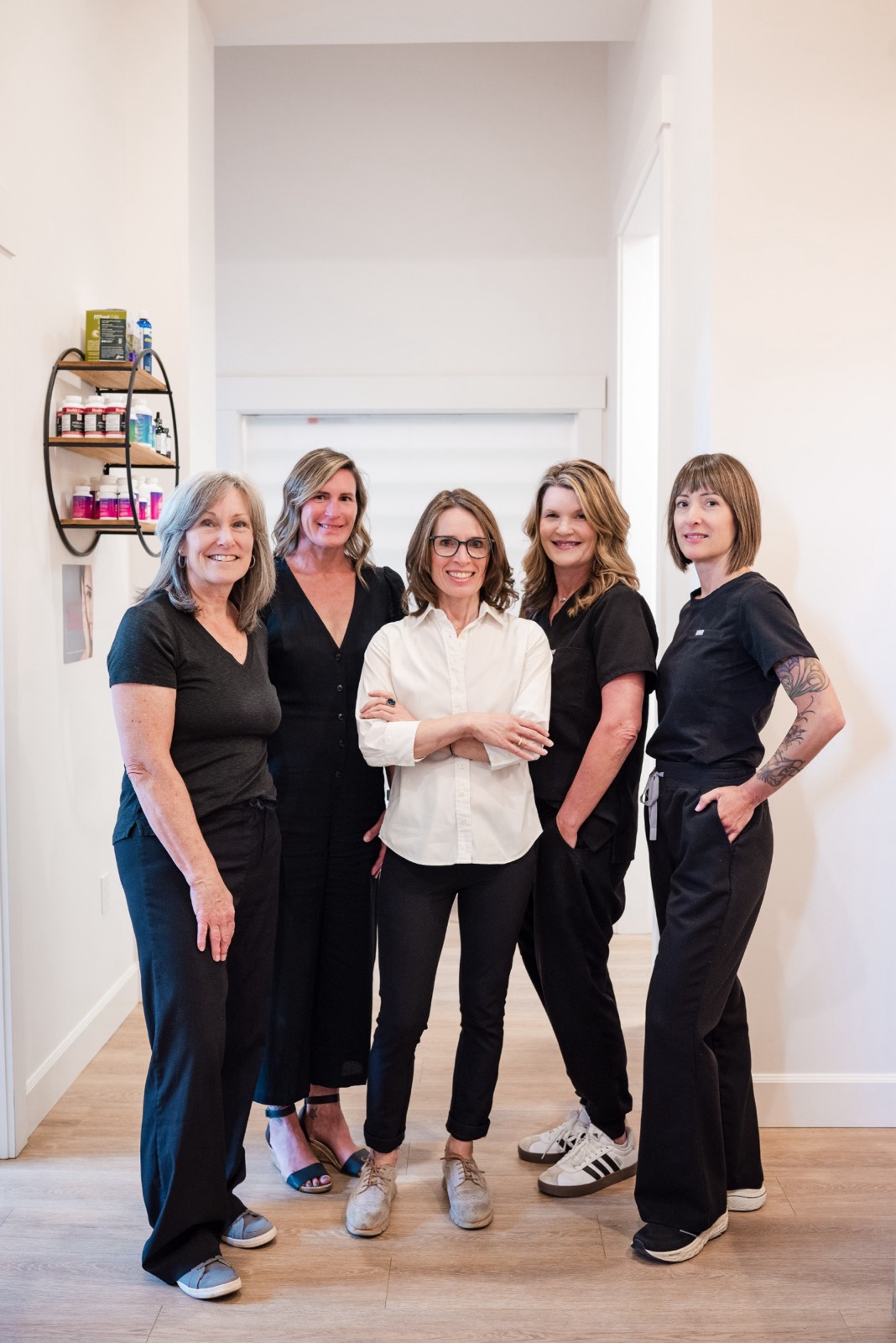 Dr. Olivia Franks with four members of the Swiftwater Medical team in the office hallway